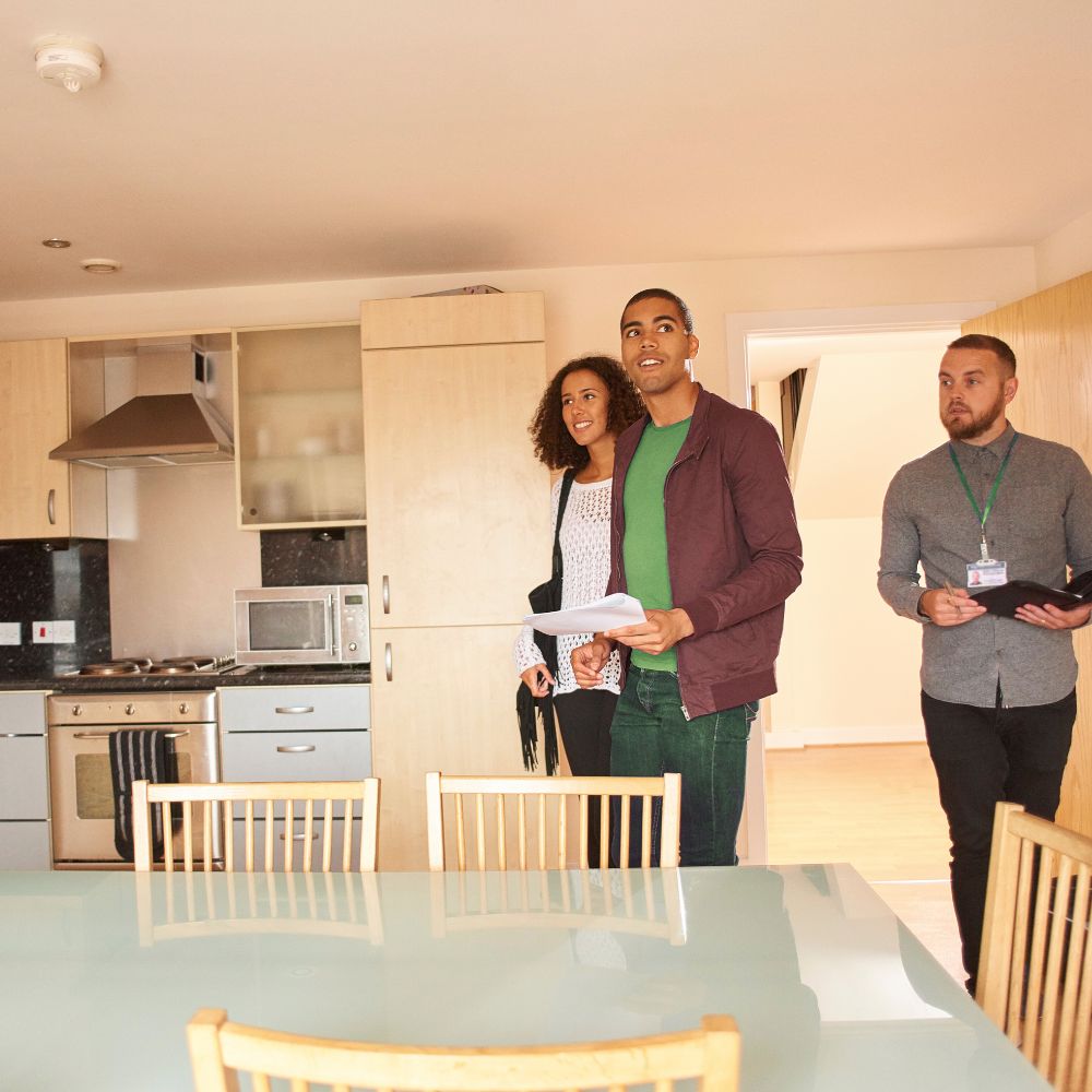 Moving House Part 3 - a young couple are viewing a kitchen in a house with a male estate agent