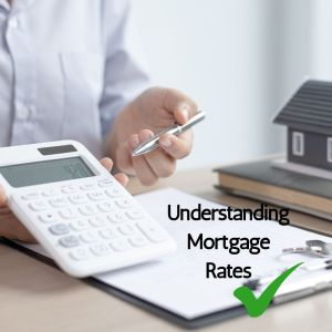 Understanding mortgage rates written on a photo with a green tick, the photo is a close-up of a man holding a white calculator and a pen over a desk with paperwork